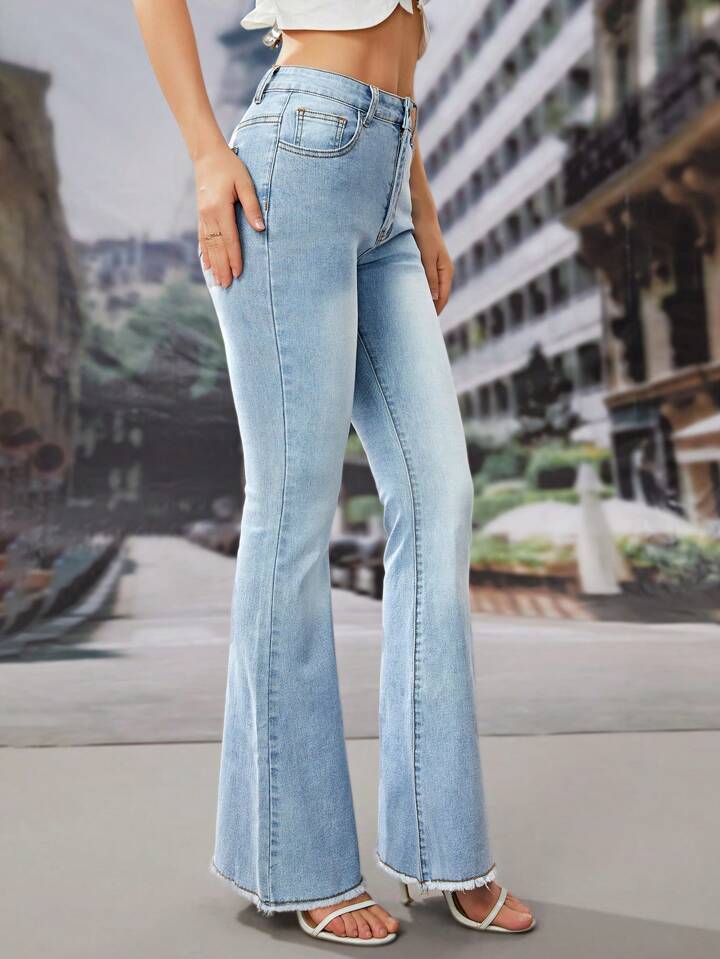 Light wash boot cut jeans with fuzzy bottoms
