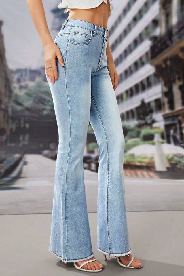 Light wash boot cut jeans with fuzzy bottoms